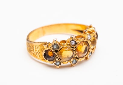 GEORGIAN TOPAZ, CITRINE AND SEED PEARL ENGRAVED GOLD RING.
