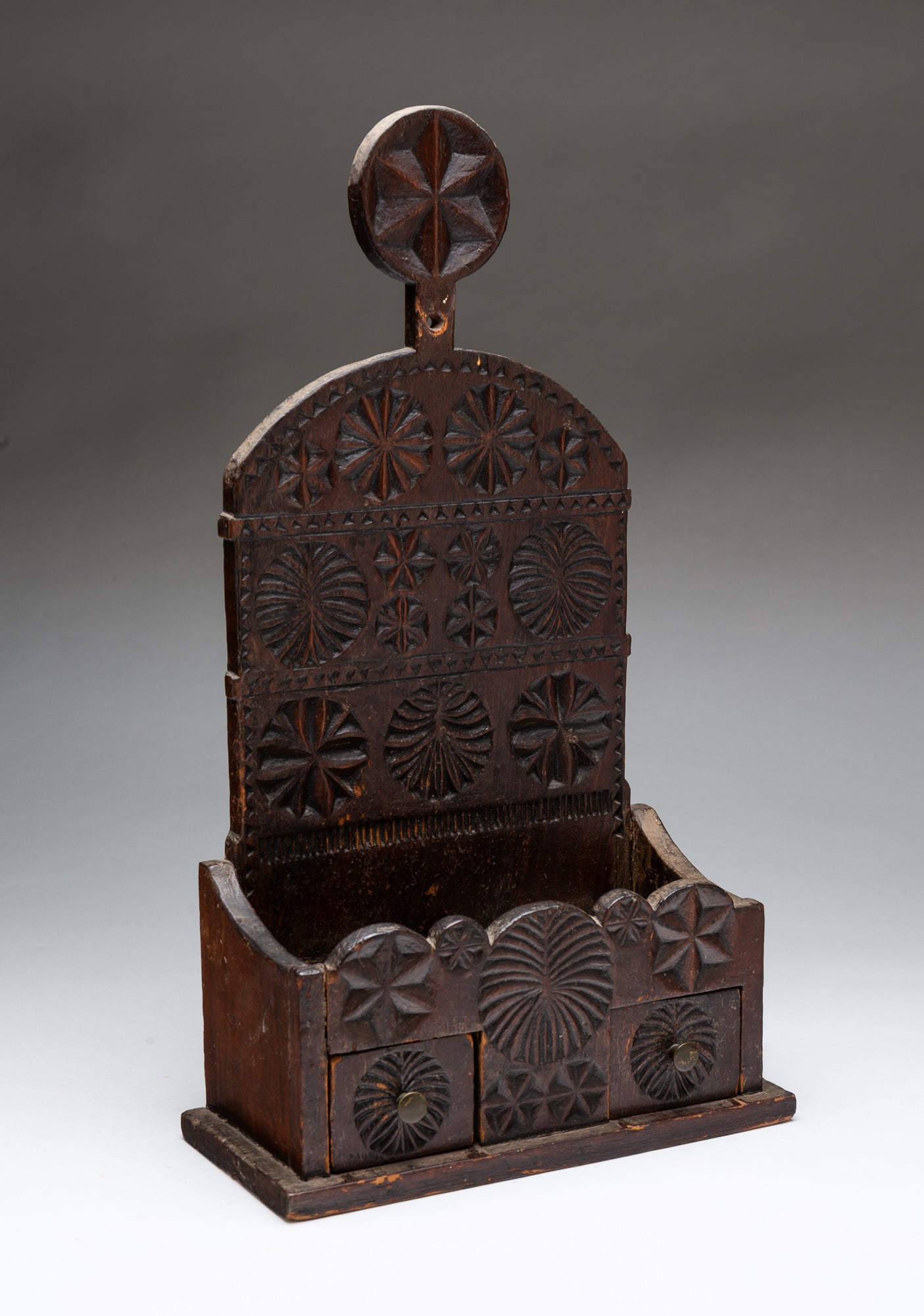 FOLKSY CHIP CARVED HANGING WALL BOX WITH DRAWERS AND LOLLIPOP HANGER.