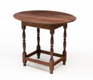 18TH CENTURY AMERICAN TAVERN TABLE WITH OVAL TOP AND STRETCHER BASE.