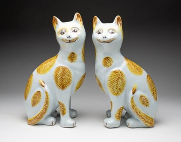 PAIR OF EARLY DELFT CAT FIGURINES.