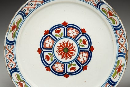TWO DELFT PLATES WITH POLYCHROME DECORATION.