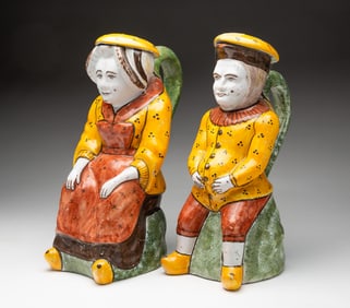 PAIR OF DELFT POLYCHROME GLAZED FIGURAL PITCHERS.