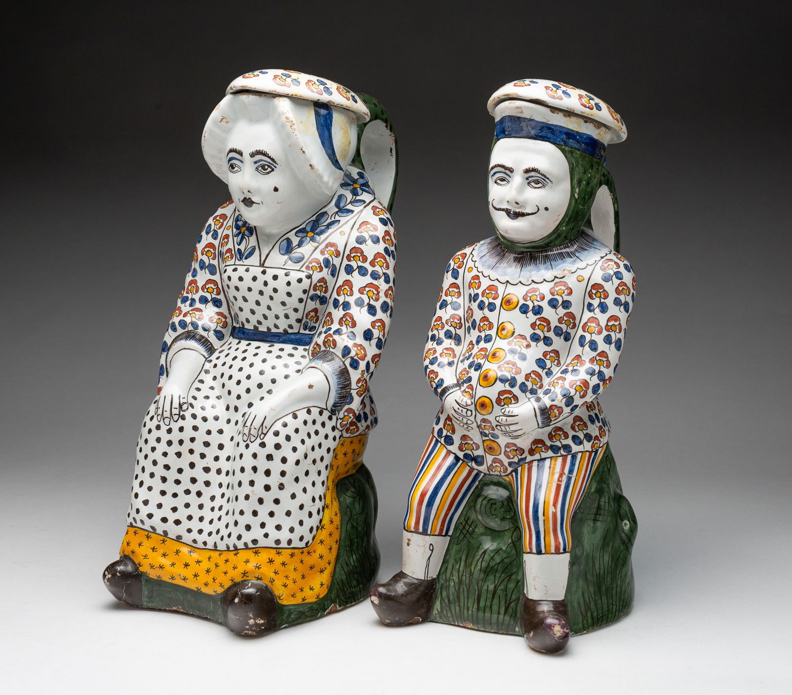 PAIR OF DELFT POLYCHROME GLAZED FIGURAL PITCHERS. (1 of 3)