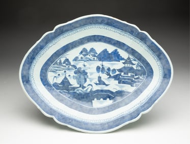 LARGE BLUE AND WHITE CANTON PORCELAIN FOOTED PLATTER.