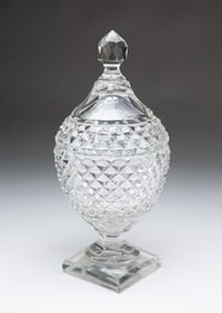 ANGLO-IRISH CUT GLASS COVERED BOWL ON PEDESTAL.