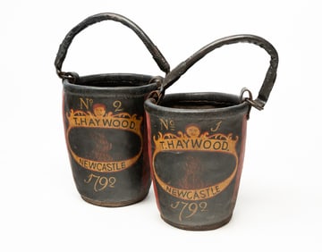 PAIR OF AMERICAN PAINT-DECORATED LEATHER AND IRON-MOUNTED FIRE BUCKETS.