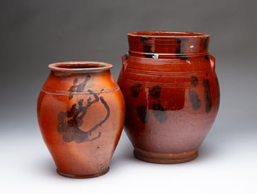 TWO NEW ENGLAND REDWARE JARS WITH MANGANESE DECORATION.
