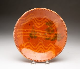 PHILADELPHIA, PENNSYLVANIA SLIP-DECORATED REDWARE PLATE.