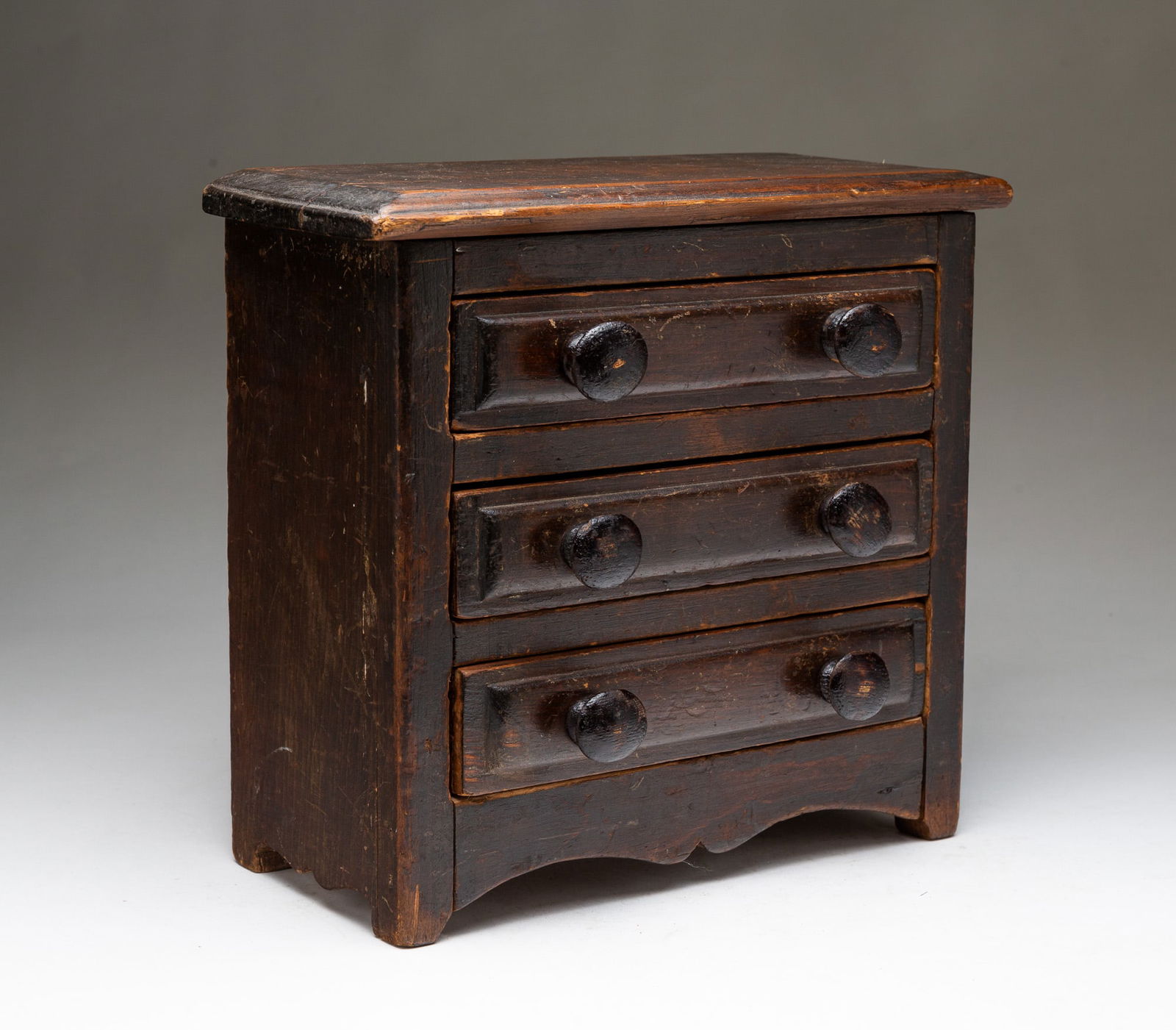 MINIATURE AMERICAN BROWN-PAINTED THREE-DRAWER CHEST. (1 of 6)