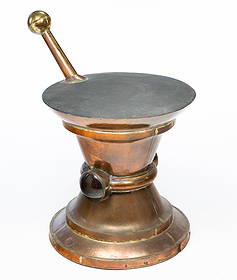 AMERICAN APOTHECARY TRADE SIGN.: Second half 19th Century. Copper and brass. Pestle and mortar shape with two red lens', one of which is hinged for inserting oil lamp. 36"h. 24"d.Provenance: From the Collection of Mark and Sandy Keil