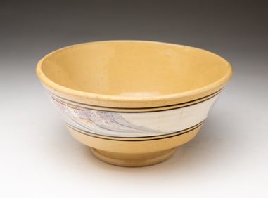 YELLOWWARE BOWL WITH PURPLE MOCHA SEAWEED DECORATION.