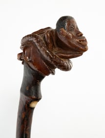 AMERICAN FOLK ART CARVED WALKING STICK WITH SNAKE WRAPPED AROUND A MAN.