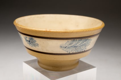 DIMINUTIVE YELLOWWARE BOWL WITH BLUE MOCHA SEAWEED DECORATION.