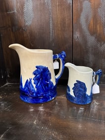 TWO AMERICAN SLEEPY EYE POTTERY PITCHERS.