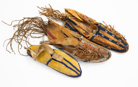 THREE PLAINS BEADED HIDE MOCCASINS.