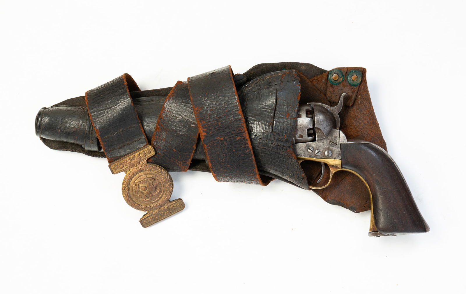 COL. SAMUEL COLT MODEL 1860 ARMY PISTOL.: American, Manufactured 1861. Steel frame, round barrel and cylinder, brass trigger guard and walnut grips. Serial number 10912. 13.5"l. With worn leather holster and belt with brass Navy buckle.Proven