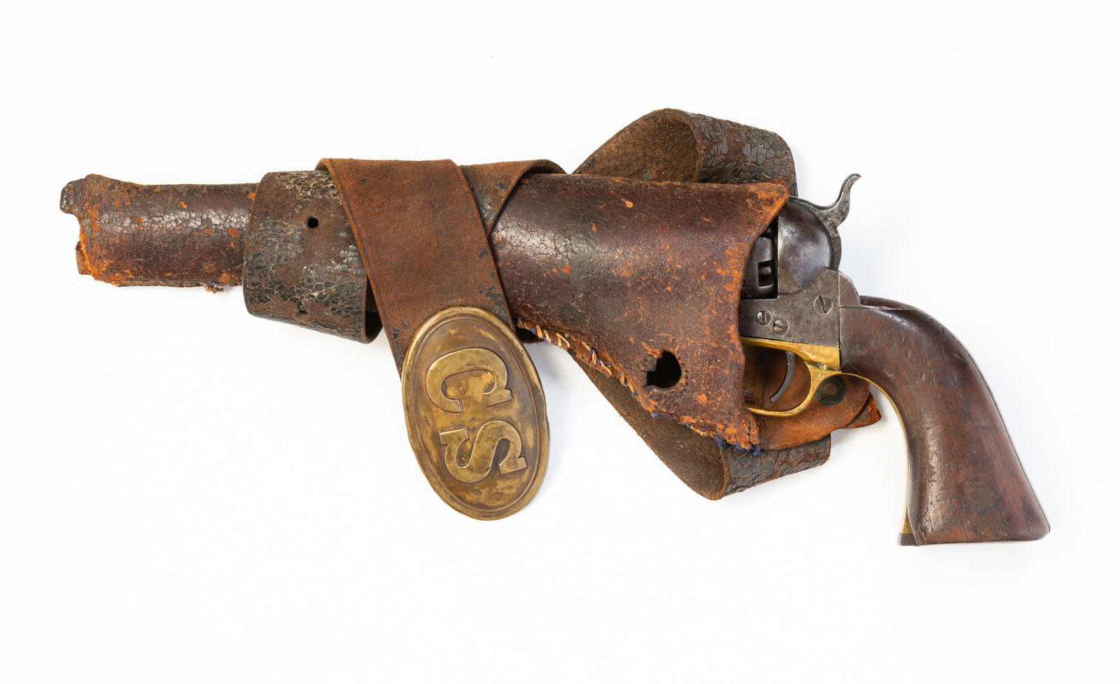 COL. SAMUEL COLT MODEL 1860 .45 CALIBER ARMY PISTOL.: American, Manufactured 1863. Steel frame, cylinder and barrel, brass trigger guard and walnut grips. Right grip has carved name "W.T. LAWRENCE". Serial number 121391. 13.5"l. With worn holster and bel