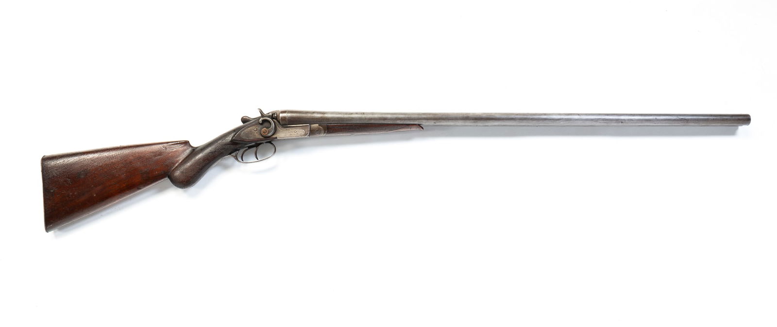 ECLIPSE GUN COMPANY DOUBLE BARREL SHOTGUN.: American, Second half 19th Century. Damascus steel barrel made in Belgium, walnut stock with checkered wrist and double rabbit ear firing mechanism. 48.5"l.Provenance: From the Lifetime Collection of