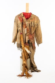 NATIVE AMERICAN BUCKSKIN OUTFIT ON MANNEQUIN PLUS LEATHER QUIVER WITH BOW AND ARROWS.