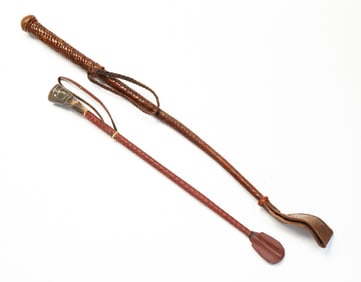 TWO BRAIDED LEATHER RIDING CROPS, INCL. OTTOMAN INLAID HORN RIDING CROP DAGGER.