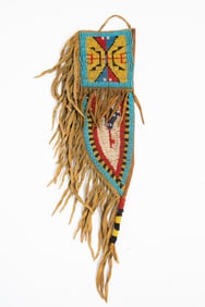 POLYCHROME BEADED HIDE KNIFE SHEATH.