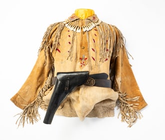 US CAVALRY EMBROIDERED AND FRINGED BUCKSKIN SHIRT ON MANNEQUIN.