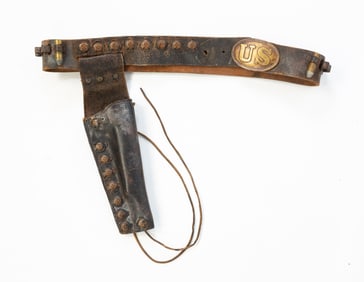 HOLSTEN BIG BELT AND HOLSTER WITH BRASS THUNDERBIRD MEDALLIONS AND OVAL U.S. CIVIL WAR BUCKLE.