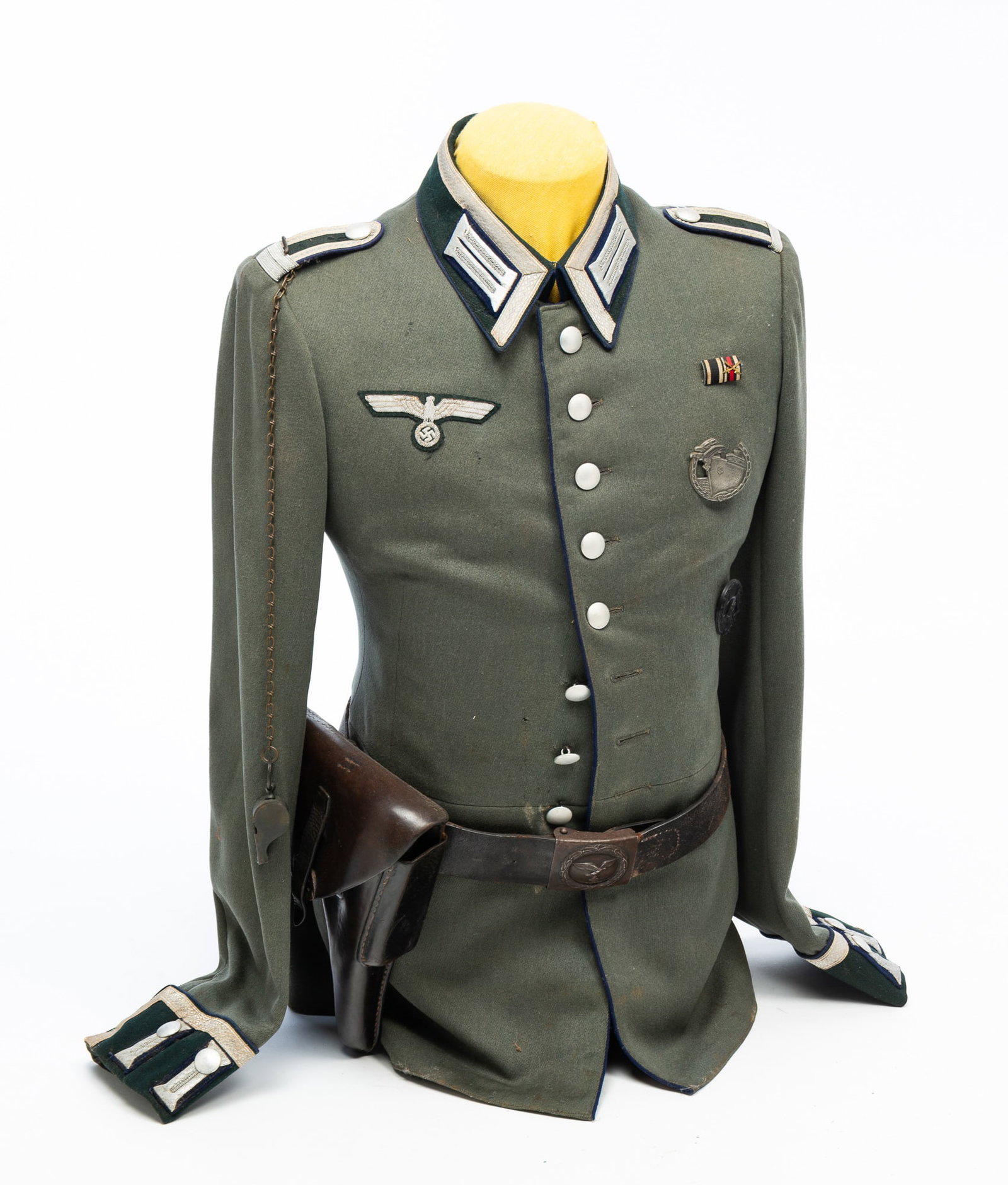 THIRD REICH GERMANY TRANSPORTATION TUNIC.: Second quarter 20th Century. Parade tunic, blue piping and silver ribbons on epaulettes.Provenance: From the Lifetime Collection of the late Ken Hanna (Chester, New Jersey).NOTE: This item does not in
