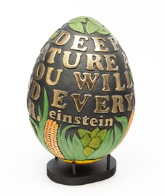 GENE KANGAS (AMERICAN, B. 1944) EGG-FORM CARVED AND PAINTED WOOD SCULPTURE WITH AN EINSTEIN QUOTE.