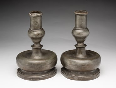 PAIR OF EUROPEAN PEWTER CAPSTAN CANDLESTICKS.