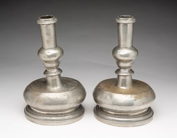 PAIR OF EUROPEAN PEWTER CAPSTAN CANDLESTICKS.
