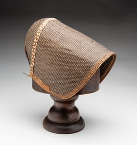 SHAKER BONNET ON WOOD STAND.