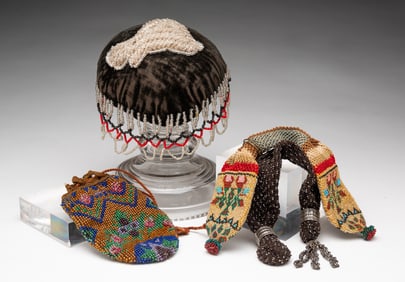 THREE AMERICAN BEADED PURSES AND A MAKE-DO BEADED VELVET PINCUSHION.