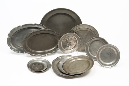 SIXTEEN PEWTER PLATTERS AND PLATES.