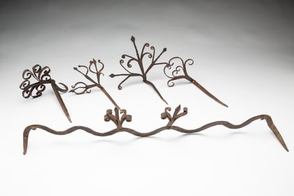 FOUR AMERICAN WROUGHT IRON STICKING TOMMY HANGERS AND UTENSIL HANGER.