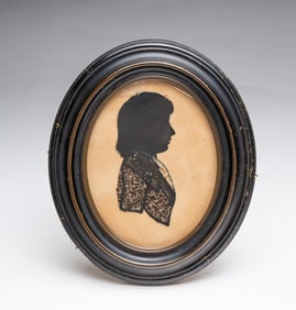 AMERICAN SCHOOL CUT PAPER AND LACE SILHOUETTE PORTRAIT OF A YOUNG MAN.