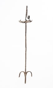 WROUGHT IRON FLOOR-STANDING RUSH LIGHT AND CANDLEHOLDER.