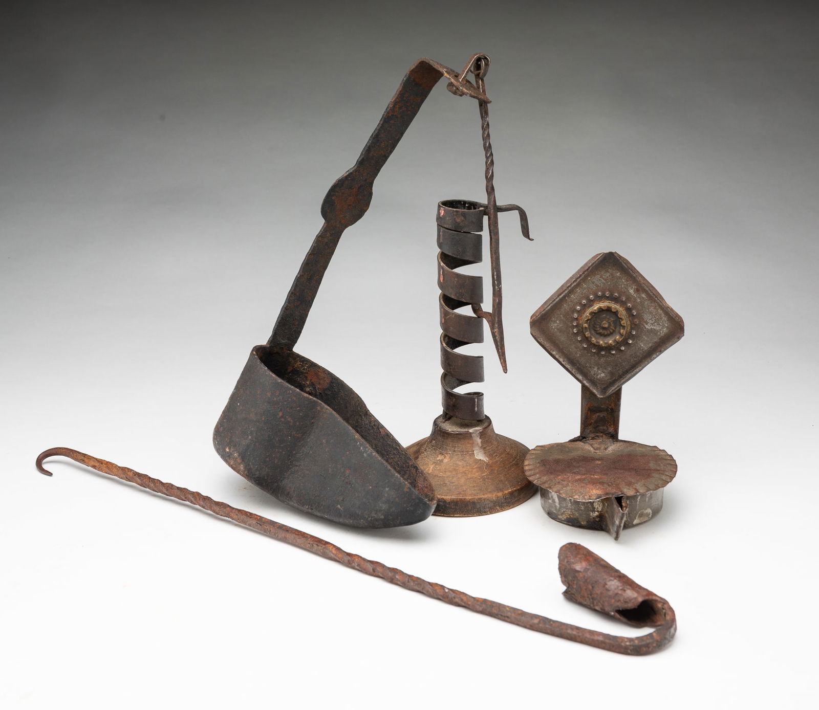 FOUR AMERICAN WROUGHT IRON AND TIN LIGHTING DEVICES. (1 of 5)