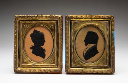 PAIR OF AMERICAN SCHOOL HOLLOW-CUT AND INK SILHOUETTE PORTRAITS OF HUSBAND AND WIFE.