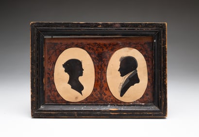 AMERICAN SCHOOL HOLLOW-CUT AND INK DOUBLE SILHOUETTE PORTRAITS OF HUSBAND AND WIFE WITH PYROGRAPHIC