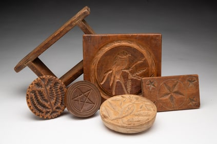 FIVE AMERICAN CARVED WOOD BUTTER STAMPS AND A CASED BUTTER MOLD.