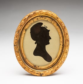 WILLIAM KING (NEW ENGLAND, ACTIVE 1804-1806) HOLLOW-CUT SILHOUETTE PORTRAIT OF A WOMAN.