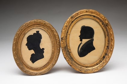 TWO AMERICAN HOLLOW-CUT SILHOUETTE PORTRAITS OF A MAN AND WOMAN.