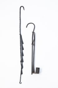 TWO AMERICAN IRON HANGING TRAMMELS.