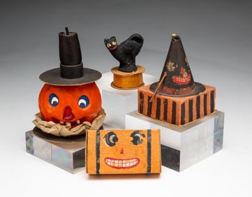 FOUR HALLOWEEN CANDY CONTAINERS.