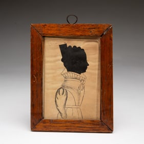 AMERICAN SCHOOL HOLLOW-CUT AND WATERCOLOR SILHOUETTE PORTRAIT OF A YOUNG WOMAN.