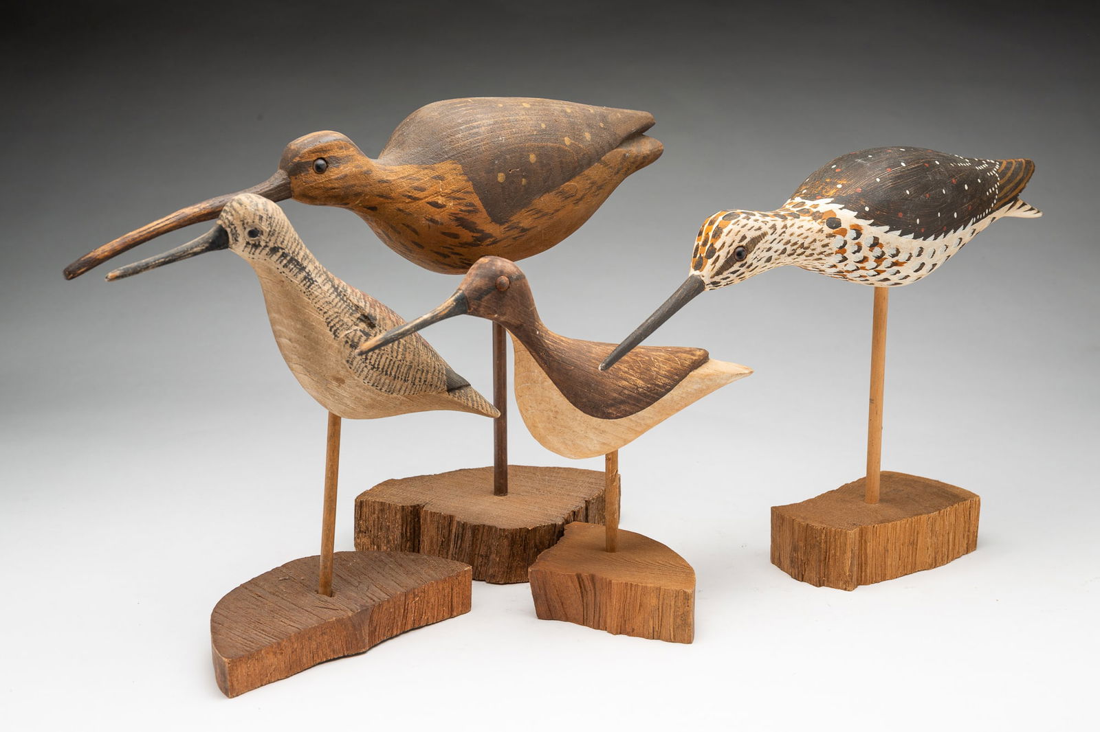 FOUR WILLIAM E. KIRKPATRICK (HUDSON, MASSACHUSETTS) CARVED AND PAINT-DECORATED SHOREBIRD DECOYS. (1 of 4)