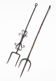 TWO AMERICAN WROUGHT IRON HEARTH FORKS.