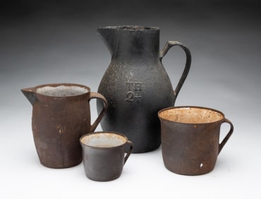 FOUR CAST IRON MEASURES.