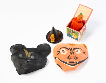 TWO GERMAN HALLOWEEN DECORATIONS AND TWO GAUZE HALLOWEEN MASKS.